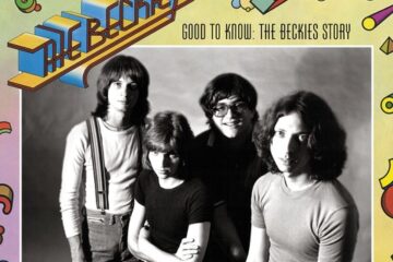 Four men pose for a black-and-white photo. The first man on the left is standing. He has long hair and bangs and is wearing a white shirt with suspenders. The second man is sitting with his arms crossed and is staring up at the camera no smiling in a black t-shirt. The third man is smiling at the camera and has glasses on. The final man on the right has long hair and a grey t-shirt on and is looking the camera blankly. Surrounding the photo are colorful abstract symbols and shapes ranging from circles to triangles to zigzag lines in blue, green, pink, yellow, and more. The words "The Beckies" are underlined and in a 3D font next to the flat words in black, "Good to know: The Beckies Story."